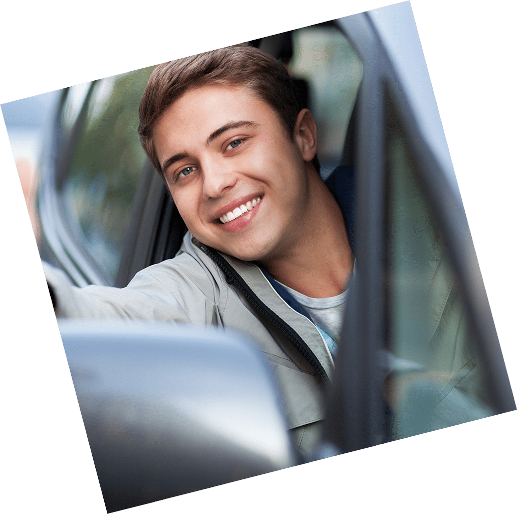 young man driving a car